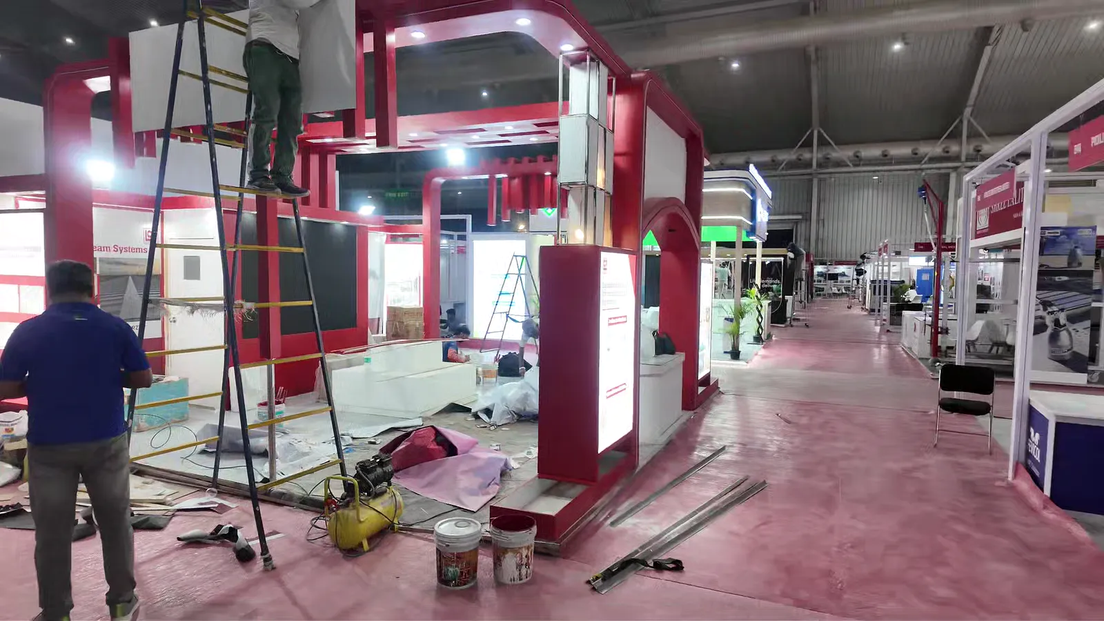 Crew building the LCP exhibition stand on site